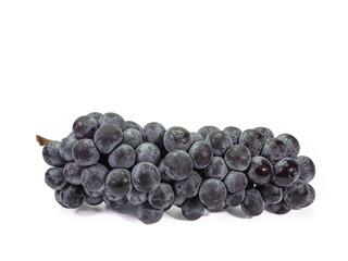The close up of ripe organic black seedless grape bunch, healthy juicy berry fruits isolated on white background.