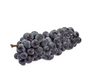 The close up of ripe organic black seedless grape bunch, healthy juicy berry fruits isolated on white background.