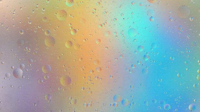 Oil drops on water surface. Abstract colorful backdrop. Pastel rainbow gradient color background