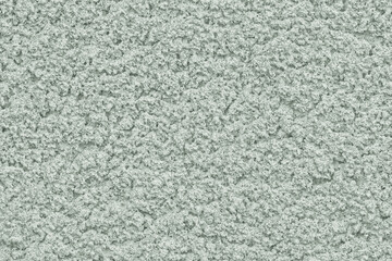 Solid background of soft pastel color with rough plaster texture. Abstract blank for design