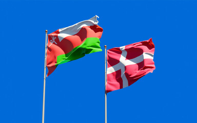 Flags of Oman and Denmark.