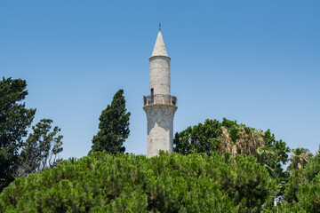 Fototapeta na wymiar Minaret of Buyuk or Djami Kebir Mosque in Larnaca of Cyprus. 