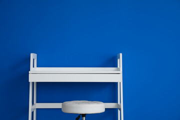 Modern table with drawer and near color wall