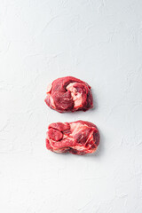 Raw Chuck eye roll steak. Organic beef. White textured background. Top view with space for text.