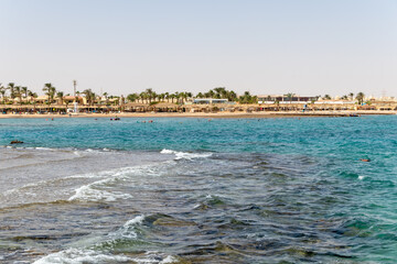 Hurghada, Egypt - September 29 2020: People relaxing on the beach in Hurghada, Egypt.