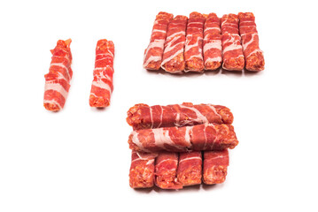 Chevapchichi in bacon isolated on white background.