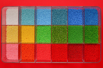 Container with colored beads.