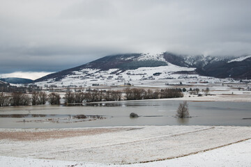 Panoramic view of big frozen puddle near Colfiorito in Umbria