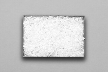 Top view, white paper filler in grey carton box