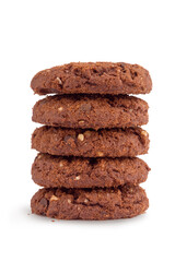 rich round cookies with nuts and chocolate, lying on a wooden plate, isolate on a white background