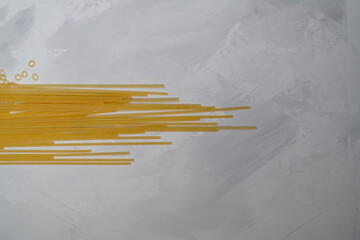long spaghetti noodles on gray background, food, cooking, ingredient