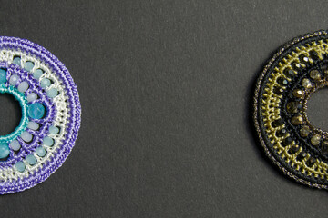 handmade wicker jewelry with natural stones on a black background