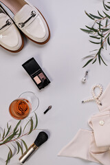 Cosmetics and fashion blogger background. Flat lay. Makeup, accessories on a light background. Top view. Vertical shot