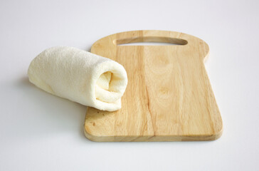 wooden Cutting board and dishcloth isolated white background.