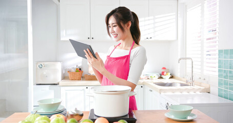 Asian housewife use tablet