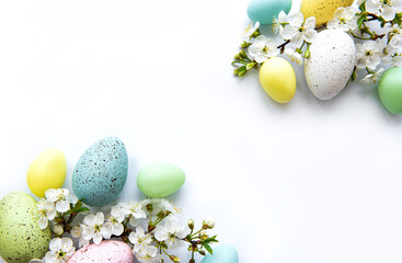Colorful Easter eggs with spring blossom flowers