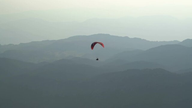 Parachutists are paragliding in Tahtali-Olympos mountains. Antalya Turkey