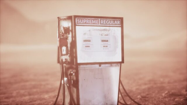 A vintage rusted gas pump abandoned in the desert
