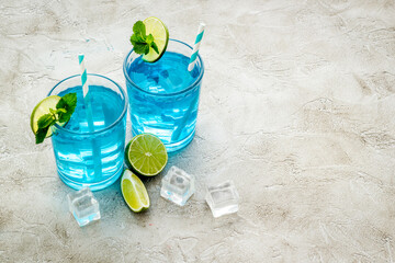 Refreshing blue Hawaii cocktail with lime and ice