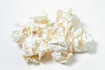 Fototapeta na wymiar Crumpled paper on a white background. A pile of crumpled paper. Creative crisis. Lack of ideas