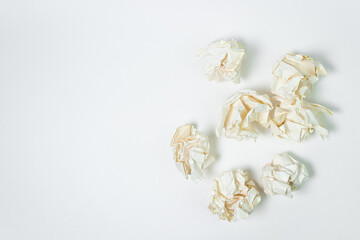 Crumpled paper on a white background. A pile of crumpled paper. Creative crisis. Lack of ideas