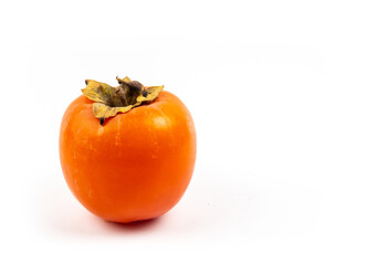 Ripe fresh persimmon isolated on white background