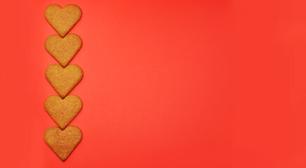 Banner. Heart shaped cookies on a red background with copy space for text. February 14, Valentine's Day or Mother's Day