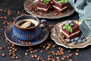 Close-up of cup of coffee and chocolate cakes