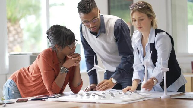 Team of young architects working together on project