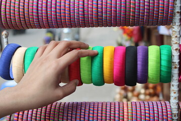 hand on colorful bangles 
