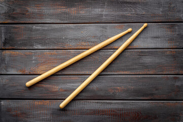 Two wooden drum sticks, top view. Music background