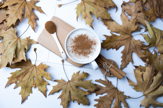 Hot, cinnamon and milk salep in a white glass.