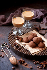  Sweet chocolate candy with liqueur in glass, dessert table