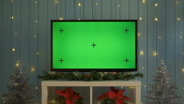 Christmas TV with green screen composited. TV or television - green screen - room - on the table. Christmas time