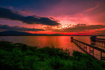 The background of the bridge stretches into the sea, with twilight light in the morning, beautiful colors, sky wallpaper and refreshing surroundings.