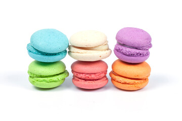 Stack of colorful macaroons is a french sweet delicacy isolated on white background.