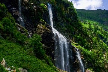 Fototapeta na wymiar beautiful high waterfall over rocks detail view