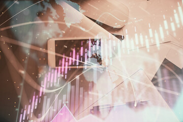 Multi exposure of forex graph hologram over desktop with phone. Top view. Mobile trade platform concept.