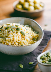 Bulgur with pepitas, healthy nutrition easy recipe from long-stored food.