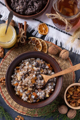 Kutya is a ceremonial grain dish with poppy seeds, dried fruits and sweet gravy, traditionally served by Orthodox Christians in Ukraine, Belarus and Russia during Christmas. Vertical format