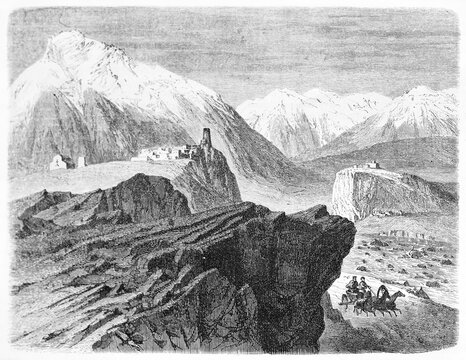 village on top of a rock surrounded by huge mountainscape Sioni and Orsete villages, Georgia. Ancient grey tone etching style art by Blanchard, Le Tour du Monde, 1861