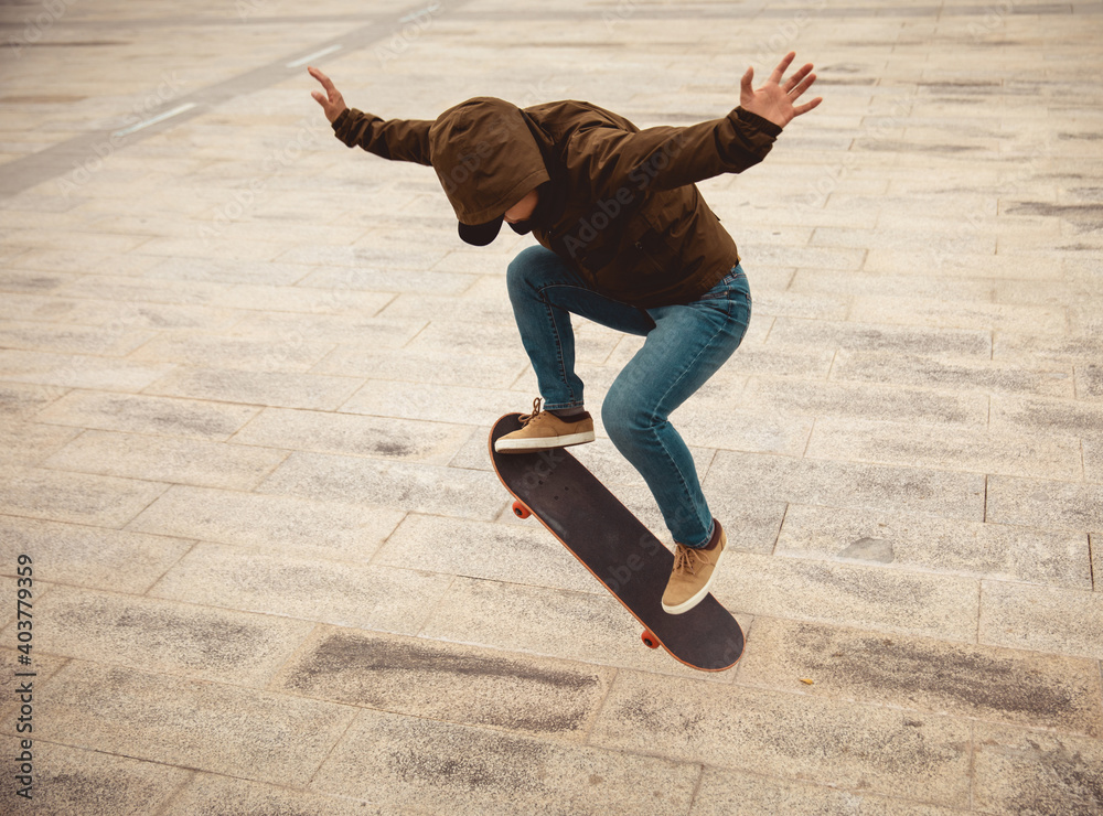 Wall mural asian woman skateboarder skateboarding in modern city