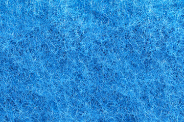 Blue felt texture. Full frame macro photography of wool fiber non-woven textile material. Abstract...