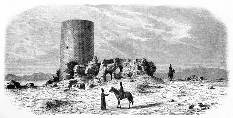 Single tower on a rocky desert ground in Tus ruins, Khorasan capital, Iran. Ancient grey tone etching style art by De Bar and Trichon, Le Tour du Monde, 1861
