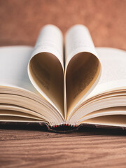 pages of a book curved into a heart shape