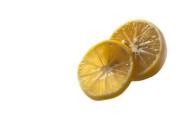 Two slices of lemon on a white background.