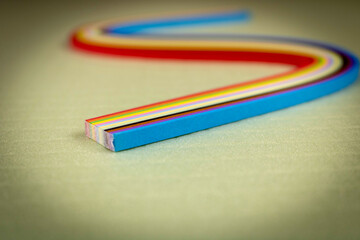 Colored quilling paper on a light background. Abstract background texture.