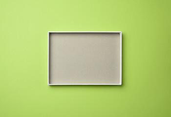 open blank paper box on a green background