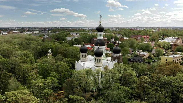 Static aerial shot of scenic old orthodox church of St. John the Forerunner in Riga with dome on reconstruction