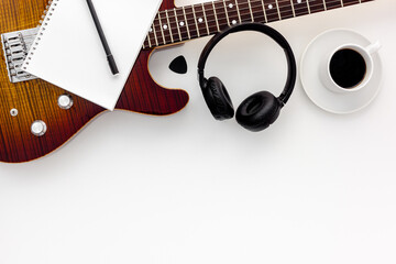 Musician work set with guitar, note and headphones